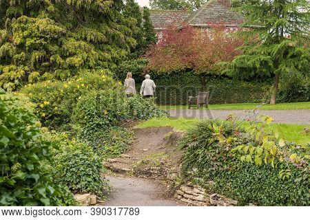 Hexthorpe, Doncaster, England - October 7, 2020. Mother And Adult Daughter On Their Back Walking And