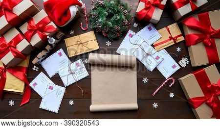 Merry Christmas Decorated Wooden Table With Wish List, Post Mail Letters Envelopes, Gifts Boxes, Pre