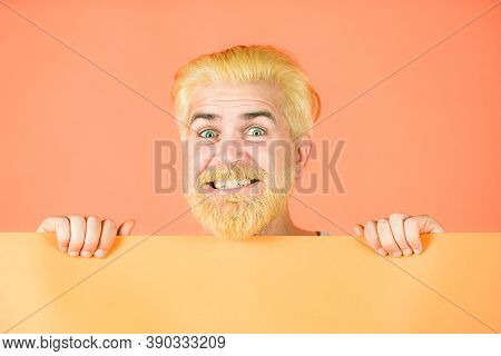 Face Close Up. Man Holding Blank Paper Board Studio Portrait. Copy Space. Discount Sale Or Season Sa