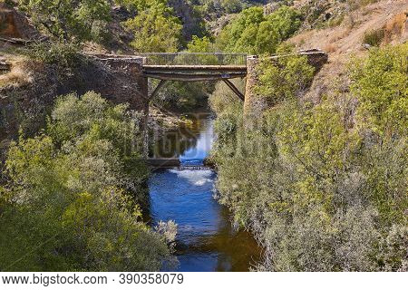 Antique Slate Stone Bridge Over Jarama River. Roblelacasa, Guadajara. Spain