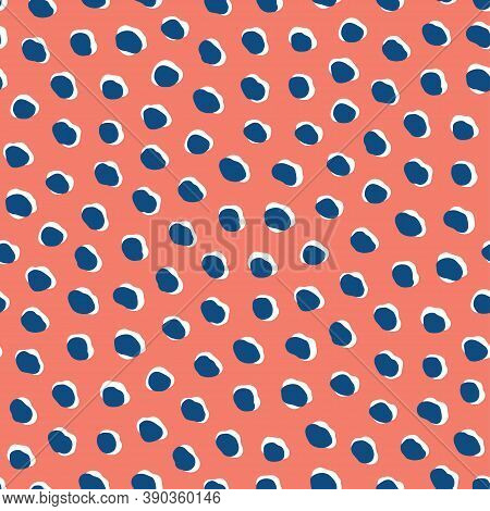 Abstract dots and shapes seamless vector pattern. Fashion textile design resembling animal skin pattern. Modern cheetah print in shades of blue and white on coral red background.