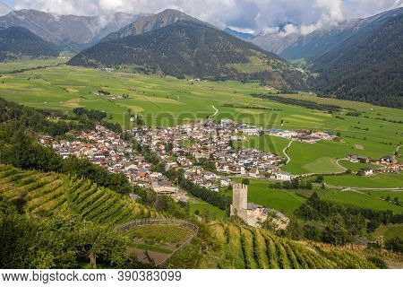 Aerial View Of The Historic Center Of Burgusio, Malles,  And The Prince's Castle, Val Venosta, South