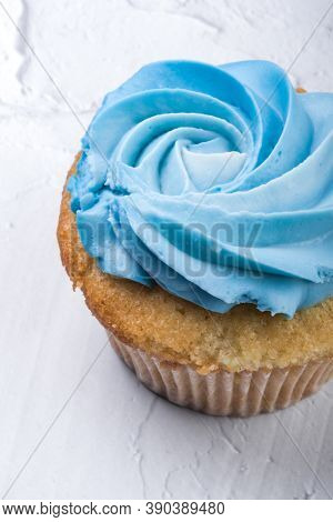 Tasty Cupcake Or Muffin With Blue Cheese Cream Frosting On White Background