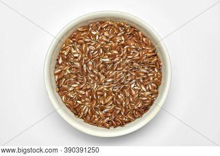 Flaxseed, Linseed In Bowl, Isolated. Bunch Of Linum Usitatissimum - Common Flax Seeds. Healthy Veget