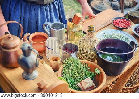 A Woman Prepares Food For American Immigrants From Europe. Table With Dishes And Food Of The First A