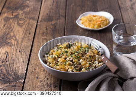 Traditional Middle Eastern Dish, Mujadara Of Lentils, Rice And Fried Onions On Wooden Table, Top Vie