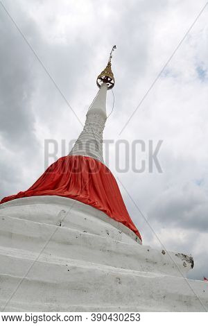 White Leaning Pagoda Has A Red Cloth Tied At The Top Beside Chao Phraya River At Koh Kret (kret Isla