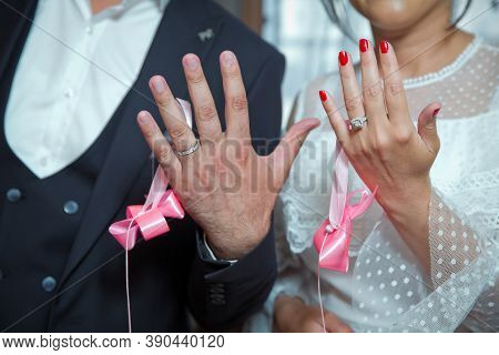Happy Couple Show Their Hands With Wedding Rings. Bride And Groom Show Their Hands With Wedding Ring