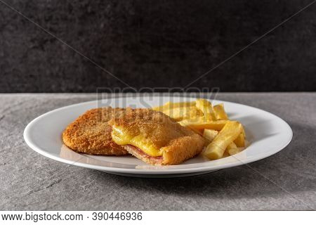San Jacobo Steak Filled With Cheese And Ham On Gray Stone