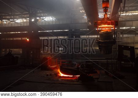 Iron Casting And The Foundry. Overhead Crane With Ladle With Molten Metal At Metallurgical Factory