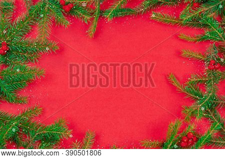 Christmas Tree Branches With Red Rowan Berries, Baka, Snow With Copy Space In The Center On A Red Ba