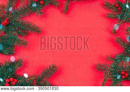 Christmas Tree Branches With Red Rowan Berries, Baka, Snow With Copy Space In The Center On A Red Ba