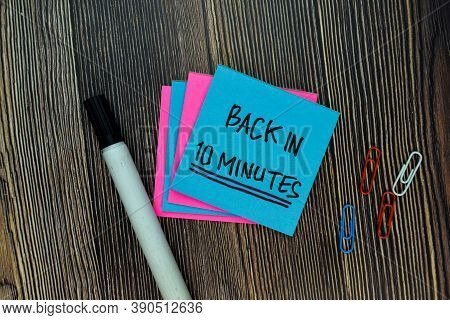Back In 10 Minutes On Sticky Notes Isolated On Office Desk