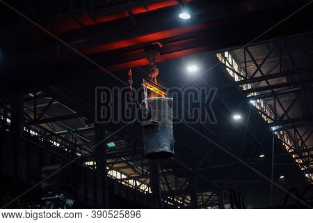 Iron Casting At The Foundry. Overhead Crane With Ladle With Molten Metal At Metallurgical Factory