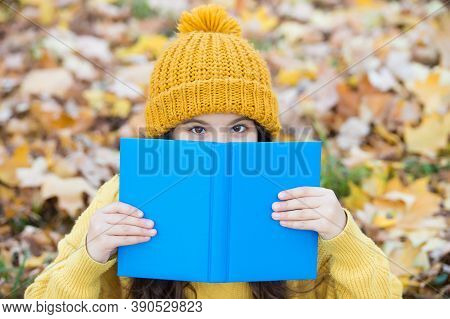 There Is No Companion More Steadfast Than Book. Little Child Cover Face With Book Autumn Leaves. Kno