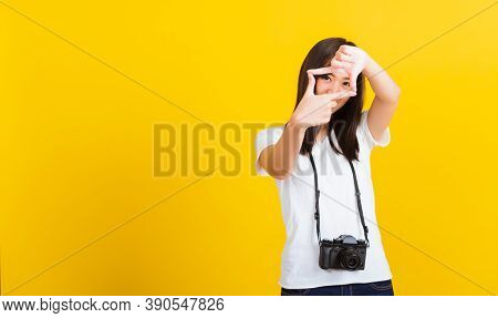 Portrait Of Happy Asian Beautiful Young Woman Photographer Execute By Hanging Digital Mirrorless Pho