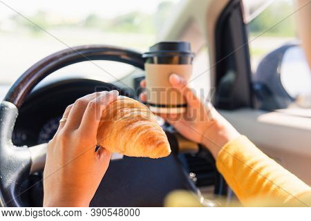 Asian Woman Eating Food Fastfood And Drink Coffee While Driving The Car In The Morning During Going 