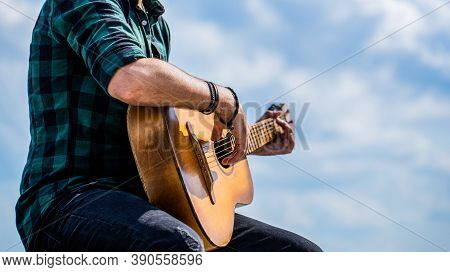 Guitars Acoustic. Male Musician Playing Guitar, Music Instrument. Mans Hands Playing Acoustic Guitar