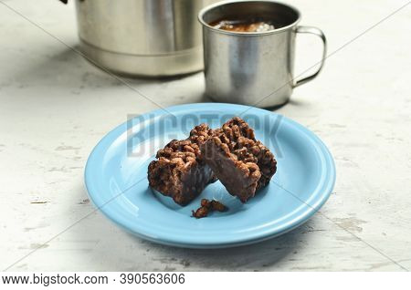 Cracker And Coffee On The Wooden Chopping Board On The Table