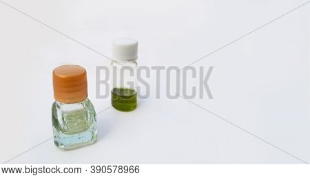 Two Small Perfume Or Attar Bottles Isolated In White Background With Selective Focus