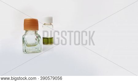 Two Small Perfume Or Attar Bottles Isolated In White Background With Selective Focus