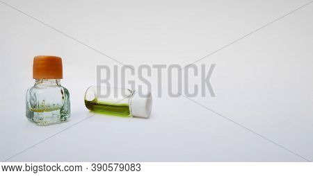 Two Small Perfume Or Attar Bottles Isolated In White Background With Selective Focus