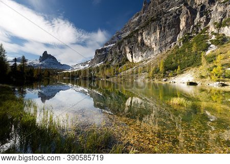 Autumn In The Dolomites, View Of Federa Lake Surrounded By Mountains. High Quality Photo