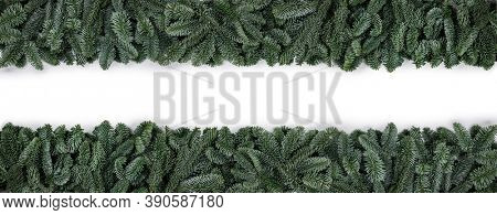 Natural noble fir Christmas tree border frame isolated on white , copy space for text