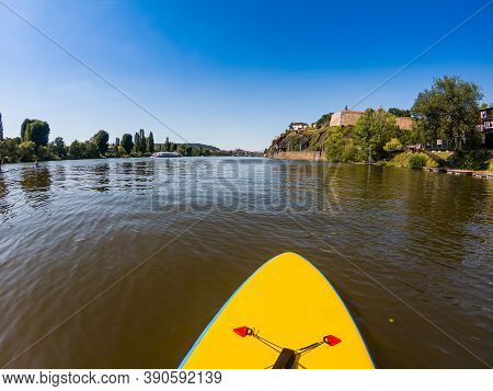Paddleboarding In Vltava - Moldau River In Prague Under Vysehrad Fortress