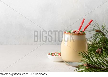 Christmas Festive Eggnog With Sprinkles Colorful Holiday Stars On White. Close Up. Copy Space. Natio