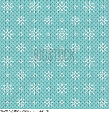 Christmas sweater snowflake seamless pattern. Knitted winter pattern with little white snowflakes on a blue background.