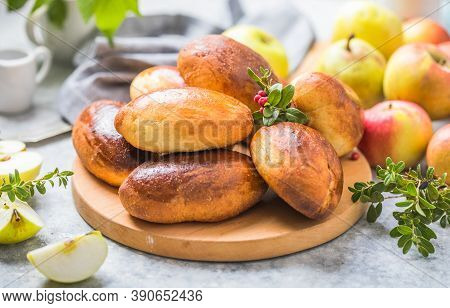 Ready-made Baked Pies (pirogi) With Apple. Traditional Russian Cuisine.