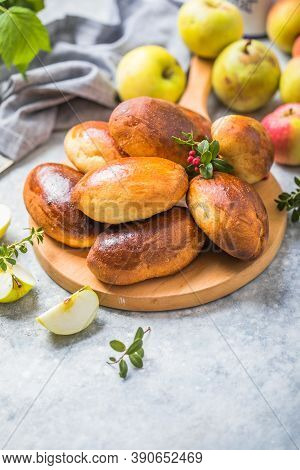 Ready-made Baked Pies (pirogi) With Apple. Traditional Russian Cuisine.ready-made Baked Pies (pirogi