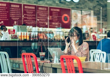 Bangkok-thailand, July 14, 2020: Unidentified Customers Work On Computer With Smartphone And Relax W