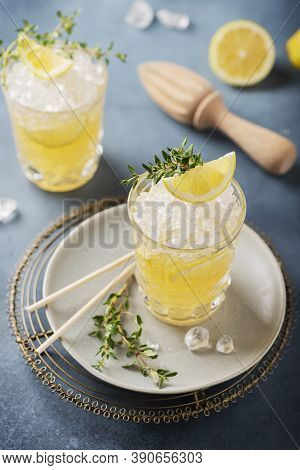 Cocktail With Lemon, Timo And Crushed Ice