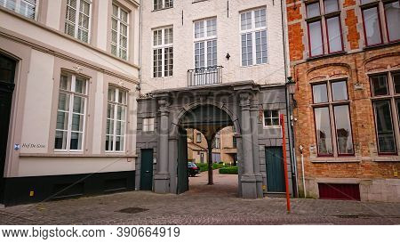 Bruges, Belgium - May 12, 2018:  Roofs And Windows Of Old Authentic Brick Houses On Street Sint-jako
