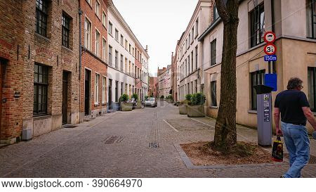 Bruges, Belgium - May 12, 2018:  Roofs And Windows Of Old Authentic Brick Houses On Street Ontvanger