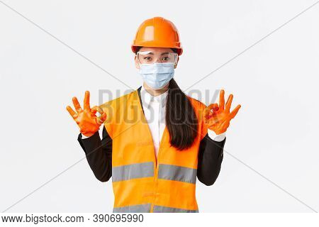 Covid-19 Safety Protocol At Enterpise, Construction And Preventing Virus Concept. Satisfied Asian Fe