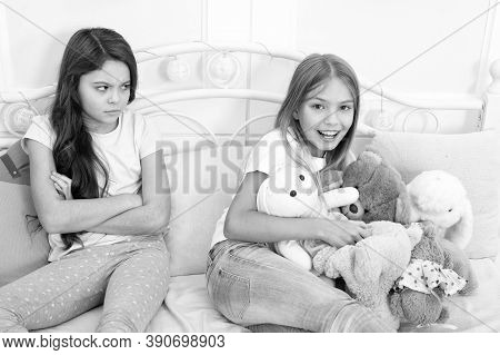 Kids Play Toys In Bed. Little Girls Spend Time Together. Friendship Sisterhood Personal Relations. T
