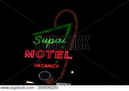 Seligman Usa - September 29 2015; Historic Route 66 Famous Supai Motel Sign Illuminated On Dark Nigh