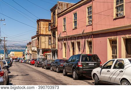 Valparaiso, Chile - December 8, 2008: Lower Middle Class Neighborhood Street With A Few Houses And C