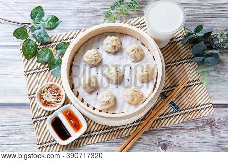 Steamed Xiaolongbao Served In A Traditional Steaming Basket (top View)