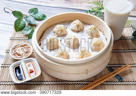 Steamed Xiaolongbao Served In A Traditional Steaming Basket