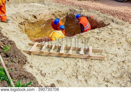 Zrenjanin, Vojvodina, Serbia-march 30, 2018:workers Are Using Shovels To Set Up Level Foundation To 