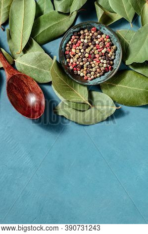 Condiments. Peppercorns Of Various Colours And Bay Leaves, Shot From The Top With A Place For Text O