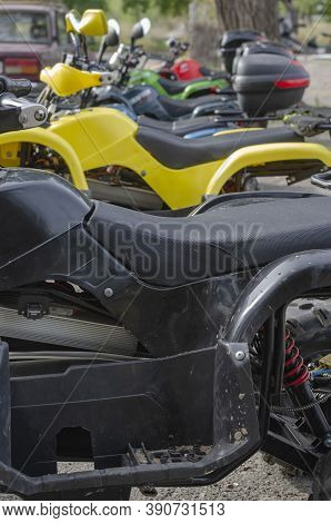Group Of Random Quad Bikes In  Line Outdoors. Rent Of Transport For Off Road Trips. Active Rest, Adv