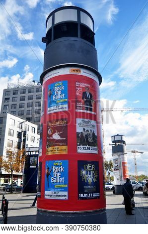 Cylinder Pole Board Advertising On Patio Of Department Store Mall Of Marktplatz Brunnen Square At Ma