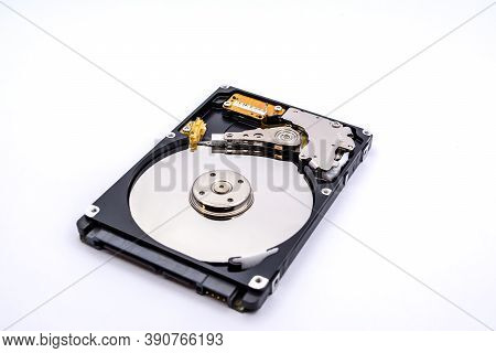 Internal Parts Of A Hard Disk Isolated On A White Background. Close Up Of Hard Disk Drive Inside Vie