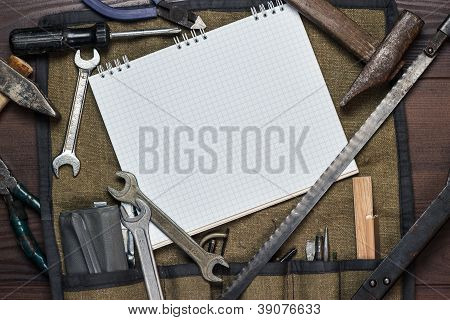 Construction Tools And Blank Notepad