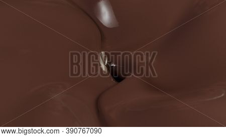 Detail of pouring hot chcocolate with splash. Studio macro shot.